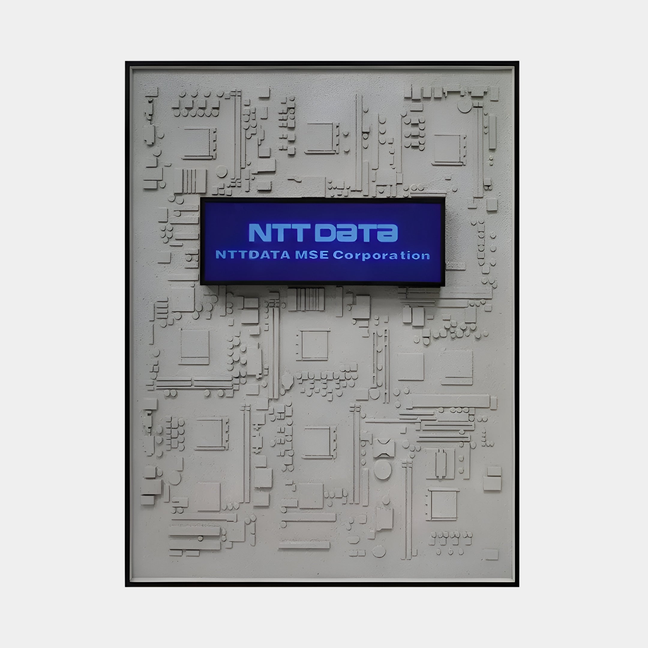 A blue screen features NTT DATA and NTT DATA MSE Corporation in white atop a circuit board pattern. This modern tech aesthetic, reminiscent of the Illume Techscape 3D LED Wall Art by Giant Sculptures, evokes an urban-inspired design with intricate details.