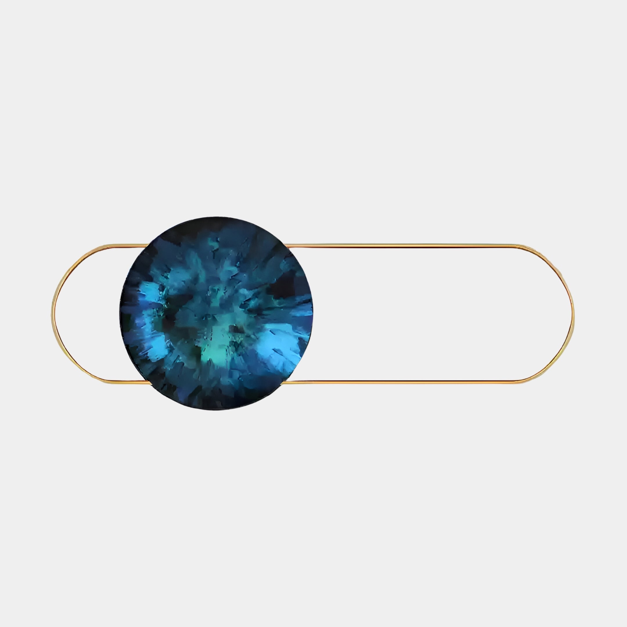 The Vitreon Sapphire Flat Crystal Porcelain with Gold Accent Wall Art by Giant Sculptures features an abstract large oval wire with a blue and teal swirl pattern reminiscent of sapphire wall art, elegantly set against a plain light background.