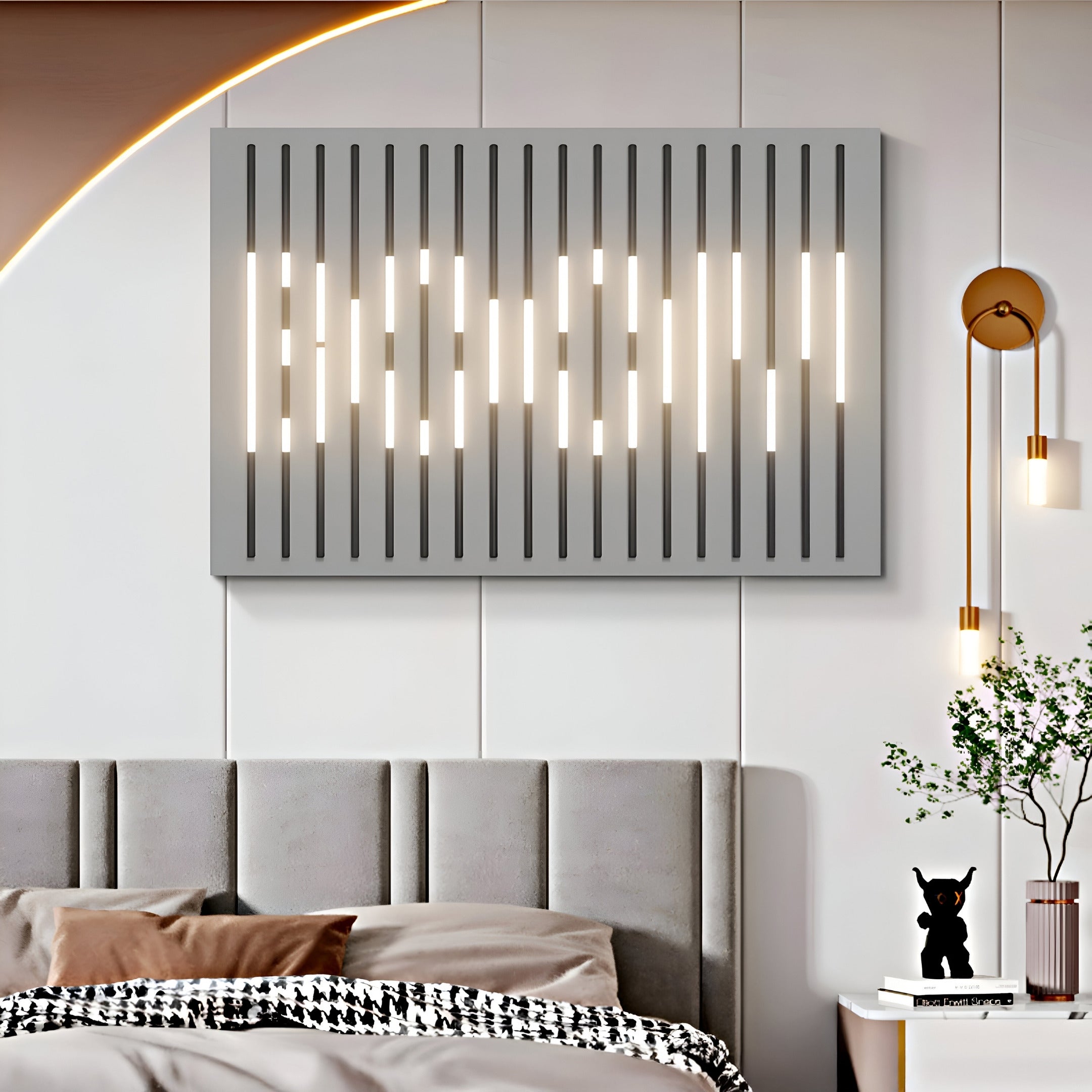 The modern bedroom decor includes a tufted gray headboard, Giant Sculptures Verlux Linear Harmony 3D LED Wall Art, a symmetrical hanging pendant light, and a small table with a vase and figurine.