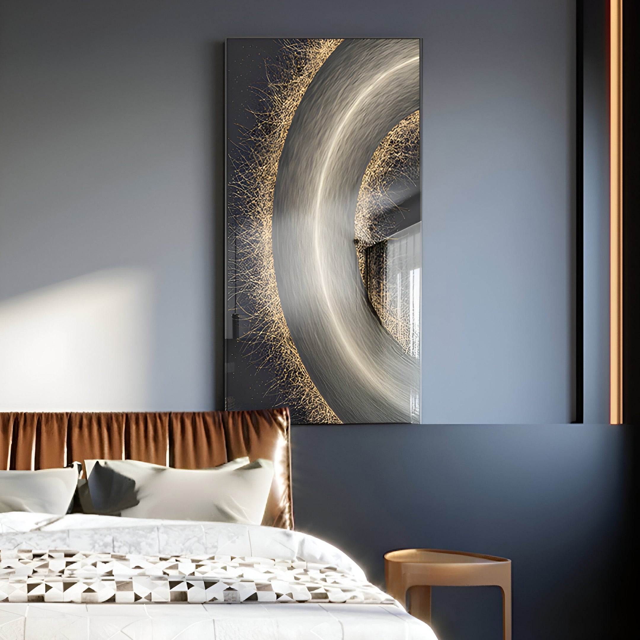 A modern bedroom features a gray and white palette with a neatly made bed and decorative pillows. The Celeste Orbit Glow LED Wall Art by Giant Sculptures, showcasing metallic and fiery swirls, hangs above the bed. Soft natural light enhances the serene ambiance of the modern interior.