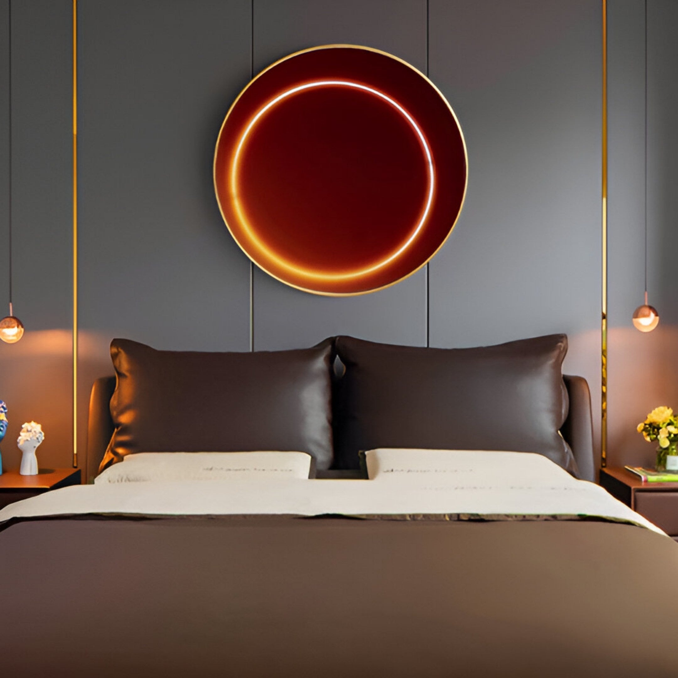 The modern bedroom showcases a large dark brown bed with two beige pillows and dark bedding. Behind it, the Aurora Ember Glow Crystal Porcelain LED Wall Art by Giant Sculptures adds warmth. Above the nightstands, LED pendant lights illuminate small plants and curated items on either side.