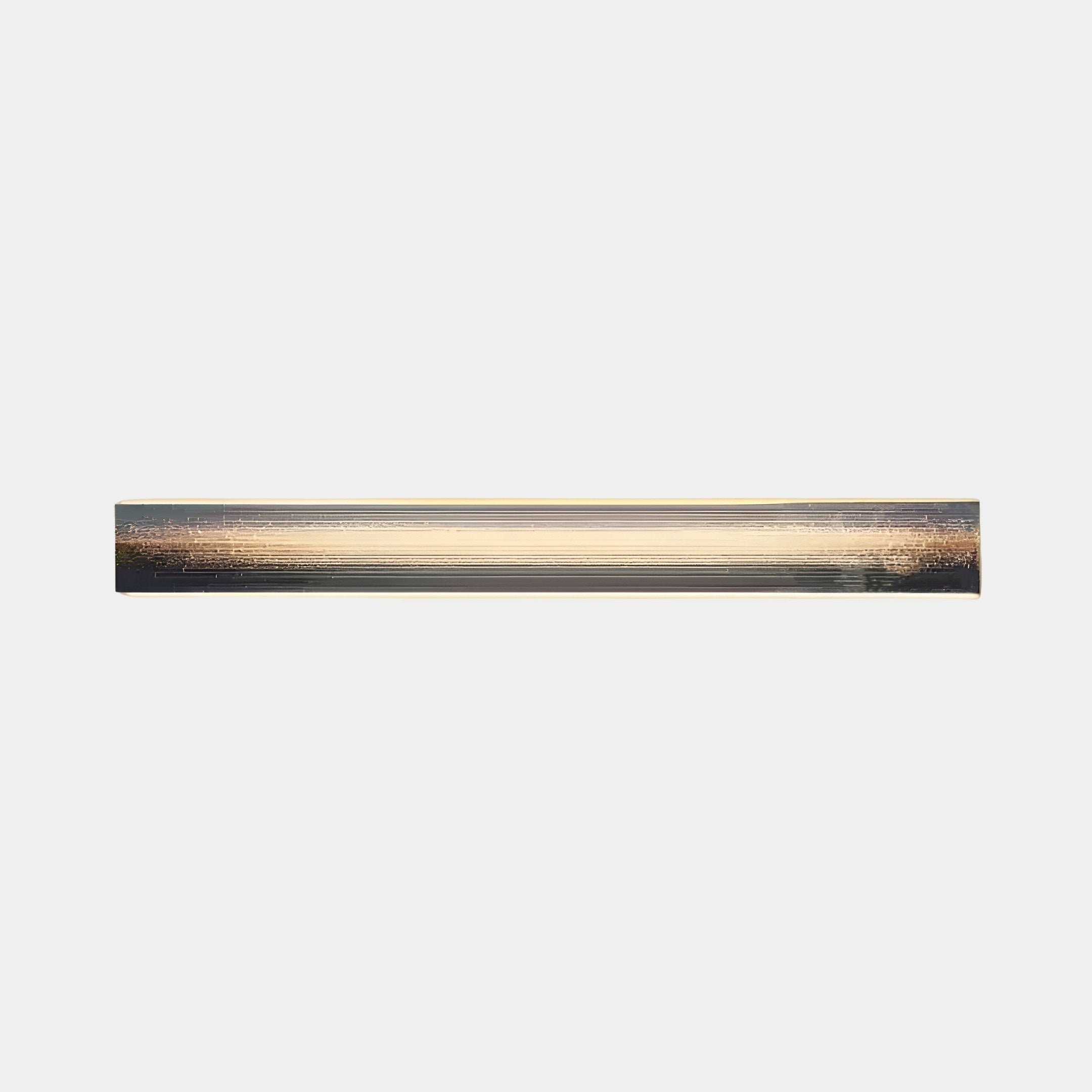 The Radiance Amber Dusk Canvas LED Wall Art by Giant Sculptures features a sleek, minimalist design with a metallic finish. Mounted on a plain white background, this horizontal fixture emits a warm glow like an amber dusk.