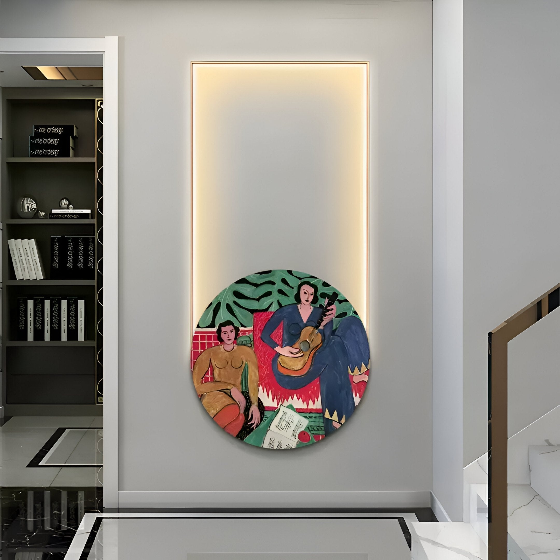 In a modern hallway, the Orion Folk Serenade Oil Painting from Giant Sculptures, featuring abstract figures and musical elements, graces an LED wall art panel. Nearby, a bookshelf filled with titles and a sleekly designed staircase complete the harmonious space.