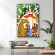 On the wall, Giant Sculptures Solana Tropical Elegance Wood Relief 3D LED Wall Art features a woman in a colorful outfit and hat beside a leopard amidst lush green leaves and abstract shapes. Below, a sofa with cushions and an adjacent plant enhances the vibrant allure of the room.