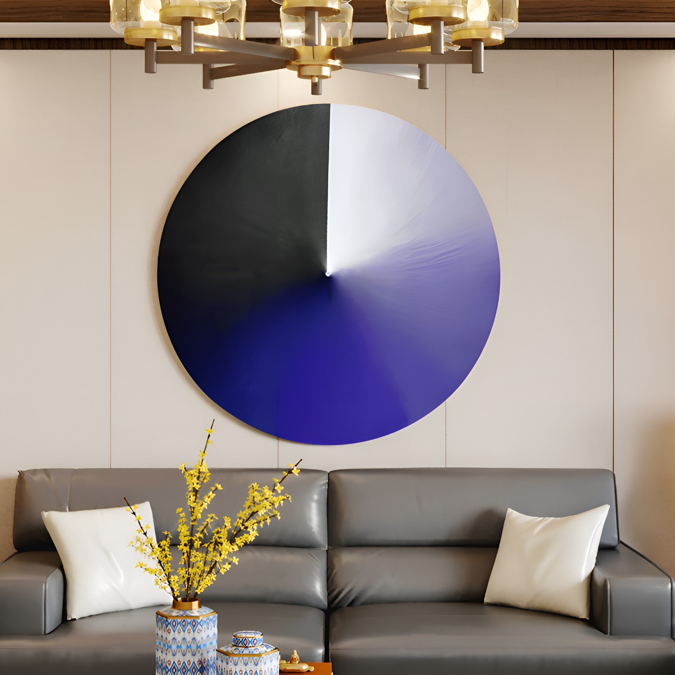 A modern living room showcases a gray couch with white pillows and a glass coffee table. The wall features the Orbit Violet Hand-Painted Canvas 3D LED Wall Art by Giant Sculptures in black, white, and blue. A decorative vase with yellow flowers on the table adds vibrancy.