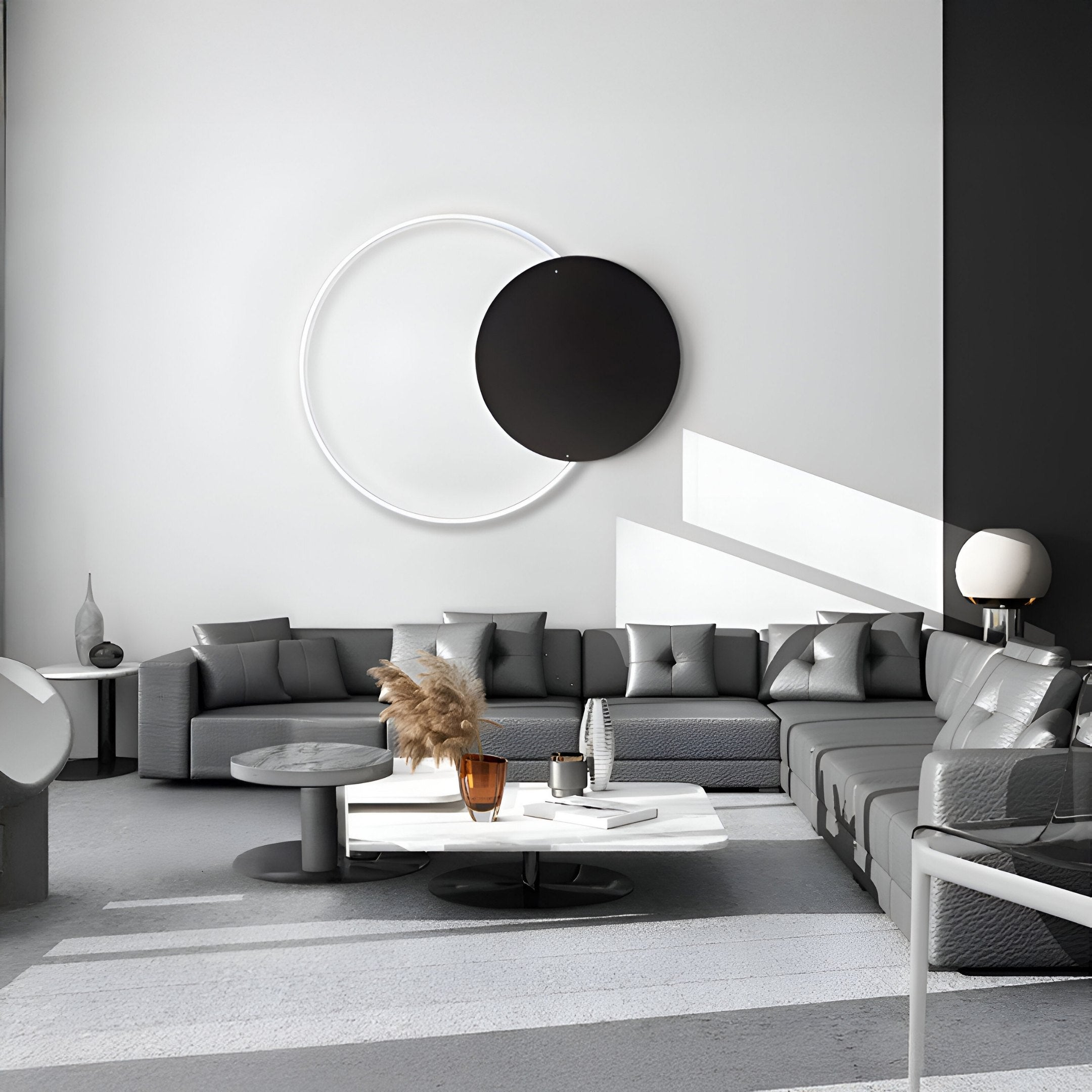 A modern living room features a gray sectional sofa, round coffee table, and Soluna Onyx Acrylic accents. Giant Sculptures Soluna Onyx Acrylic 3D LED Wall Art with circles adds depth. Natural light enhances the sleek design and minimalist decor.