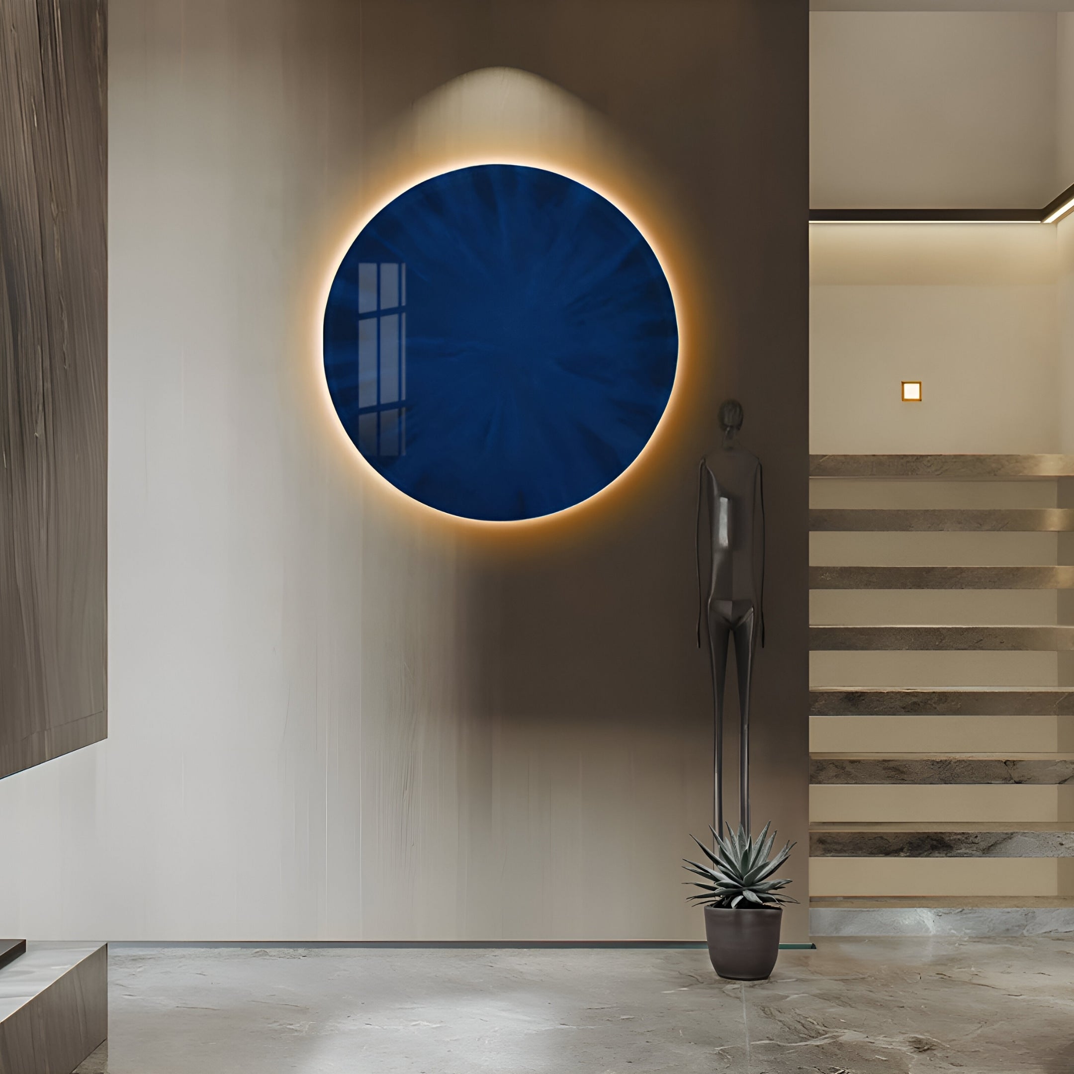 The contemporary space features the Lumea Vibrant Blue 3D LED Crystal Porcelain Wall Art by Giant Sculptures with subtle backlighting on a beige wall. A tall abstract statue and a small potted plant flank the marble-step staircase, all set against a polished stone floor.