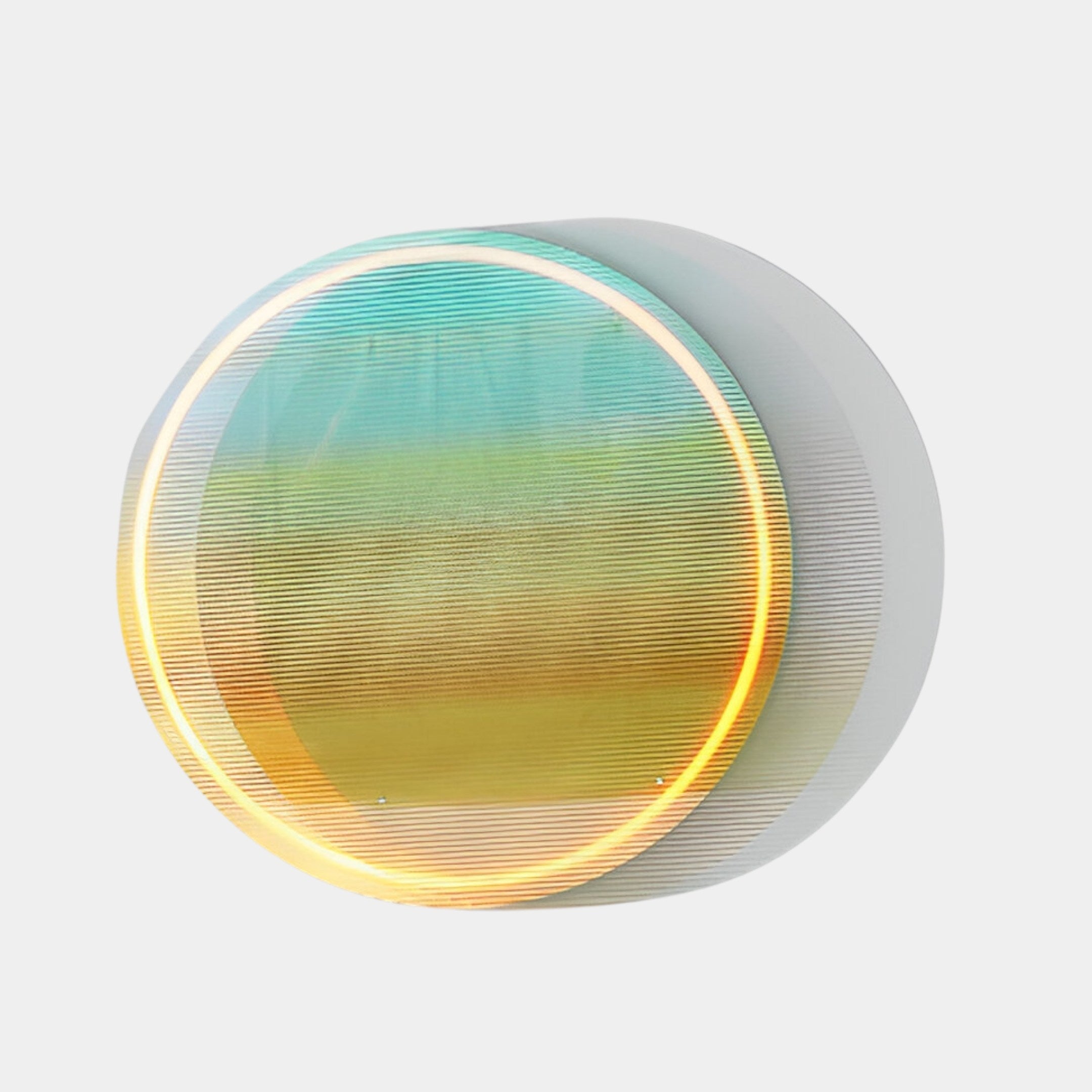 The Chromia Tropical Dawn Acrylic LED Wall Art by Giant Sculptures is a circular, multicolored, translucent piece with horizontal lines and Coastal Sunrise hues. Its blue, green, yellow, and orange shades cast soft shadows on light backgrounds for a glowing halo effect.