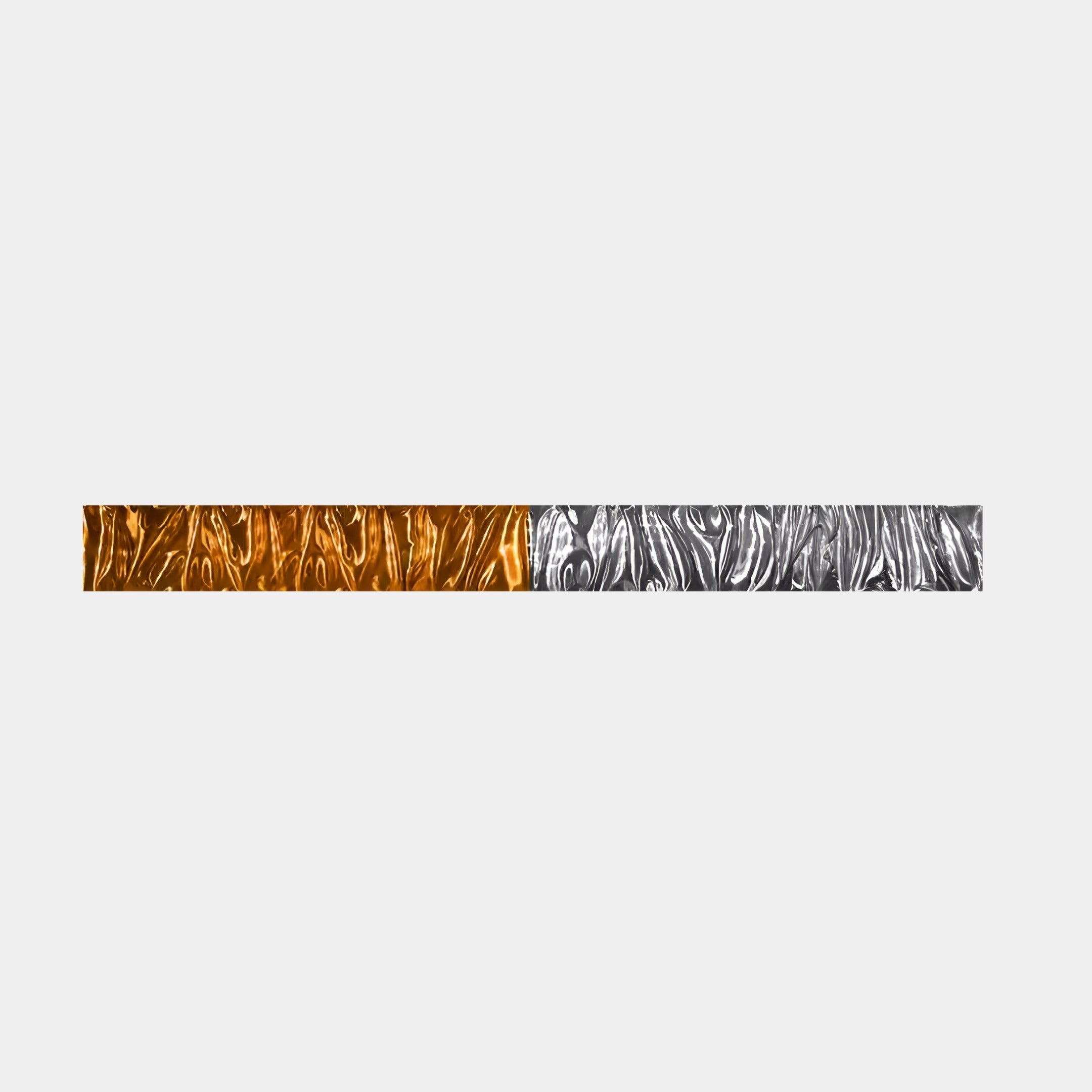 The Textura 3D Amber and Silver Leather Design Wall Art by Giant Sculptures features a long, narrow rectangular bar. Its textured pattern with an orange left half and metallic silver right perfectly complements contemporary interiors against a plain light gray background.