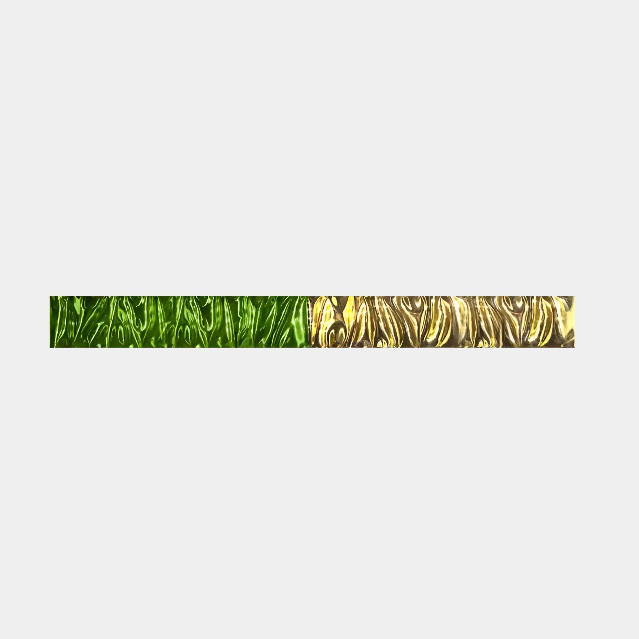 The Textura 3D Green And Gold Leather Design Wall Art by Giant Sculptures features a thin, horizontal bar with a detailed wavy pattern in green and gold leather set against a light gray background, creating a striking piece.