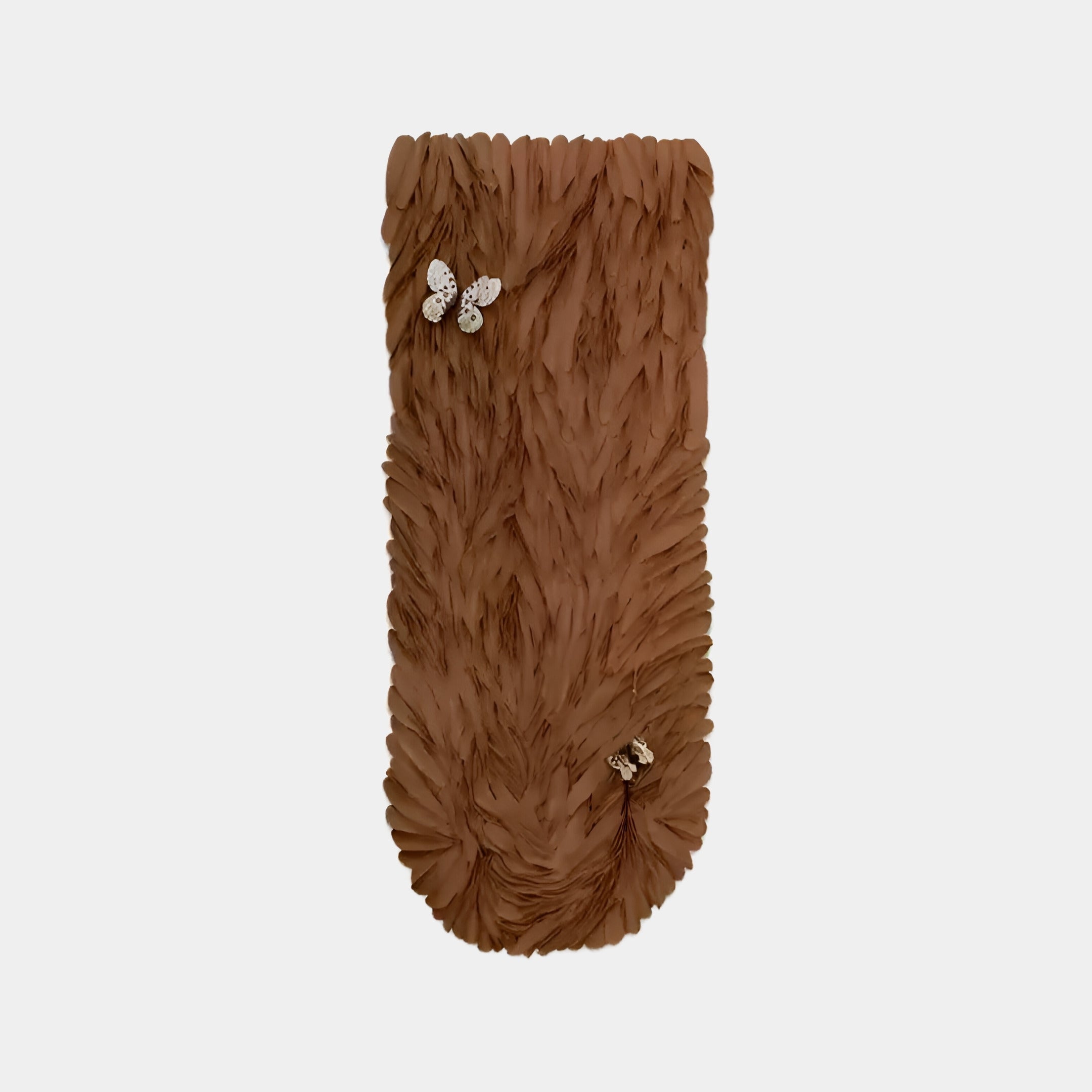 A Giant Sculptures phone case resembling their Blossom Warm Terracotta Leather 3D LED Wall Art features a brown, textured design with intricate feather-like patterns and two butterfly decorations, standing out beautifully against a plain white background as a modern accessory.