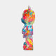 Side view of the 50cm Hype bear sculpture with vivid shades of pink, red, blue, and orange.