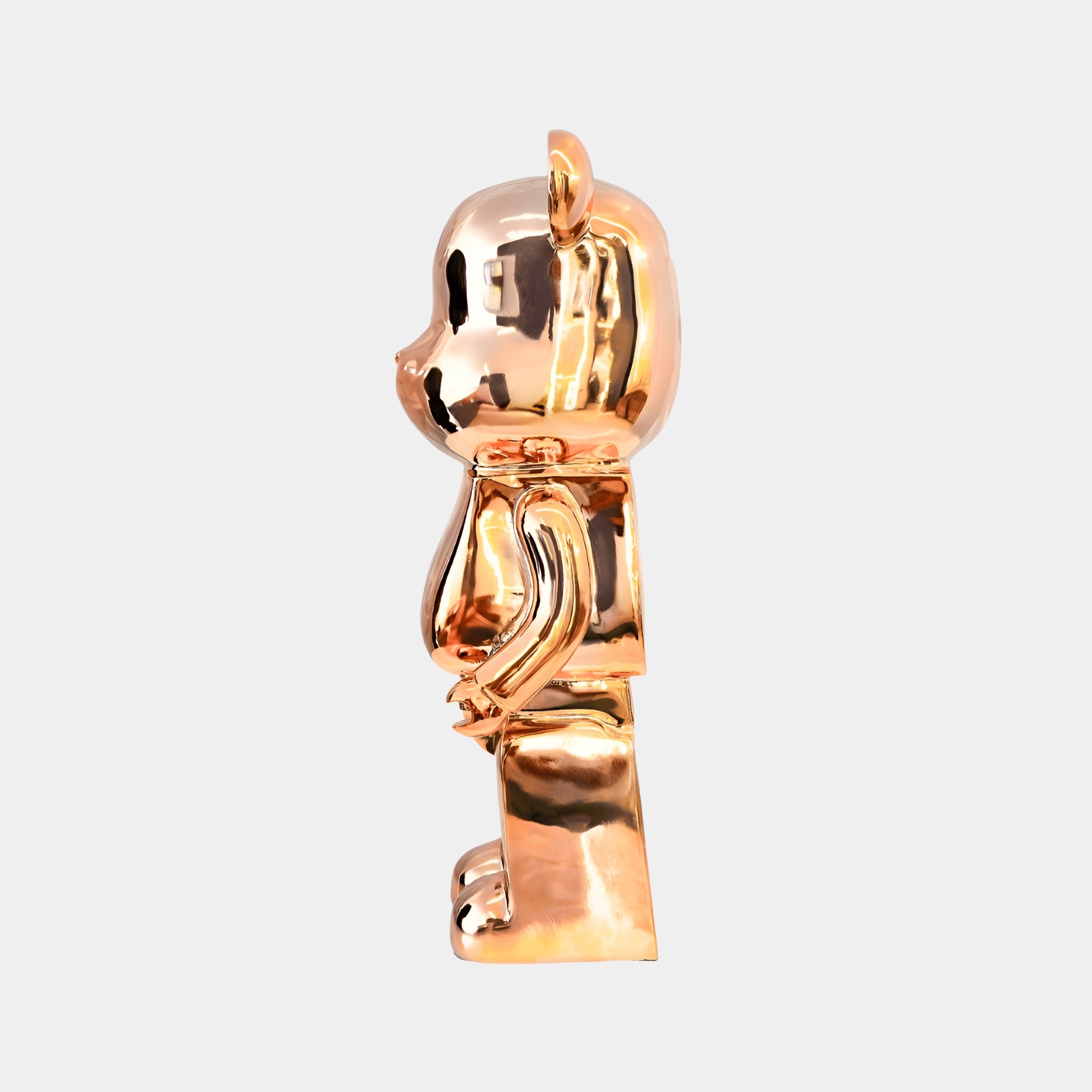 Angled view of Rose Gold Bear Sculpture, emphasizing the rose gold shine and soft reflective surface.