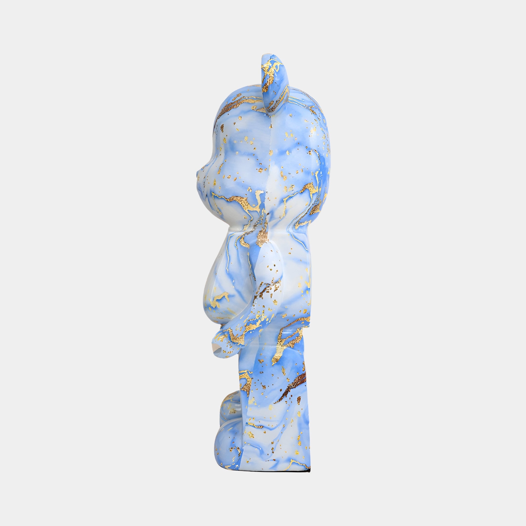 Angled view of Ocean Spray Bear Sculpture, highlighting the marble-like effect with blue and gold hues in a modern art piece.