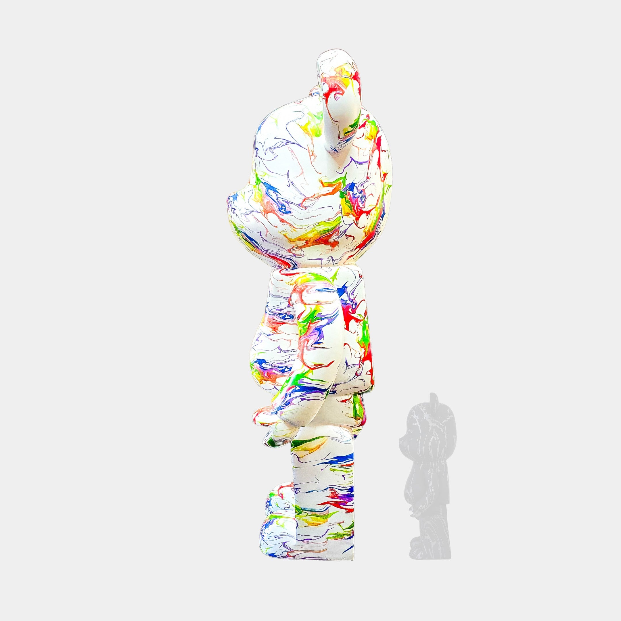 The Vogue Bear Sculpture by Giant Sculptures is a colorful 165cm bear-shaped figure with a paint-splattered pattern in reds, greens, blues, and yellows. Perfect for home decor, it stands on a white background with the faint shadow of a smaller grayscale figure nearby.