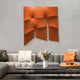 A modern living room includes a white and gray sofa with elastic fabric cushions in white and bold orange, and a sleek coffee table with a vase of dried grasses. The wall features Giant Sculptures Contours Bold Orange Elastic Fabric 3D Wooden Wall Art alongside abstract geometric artwork.