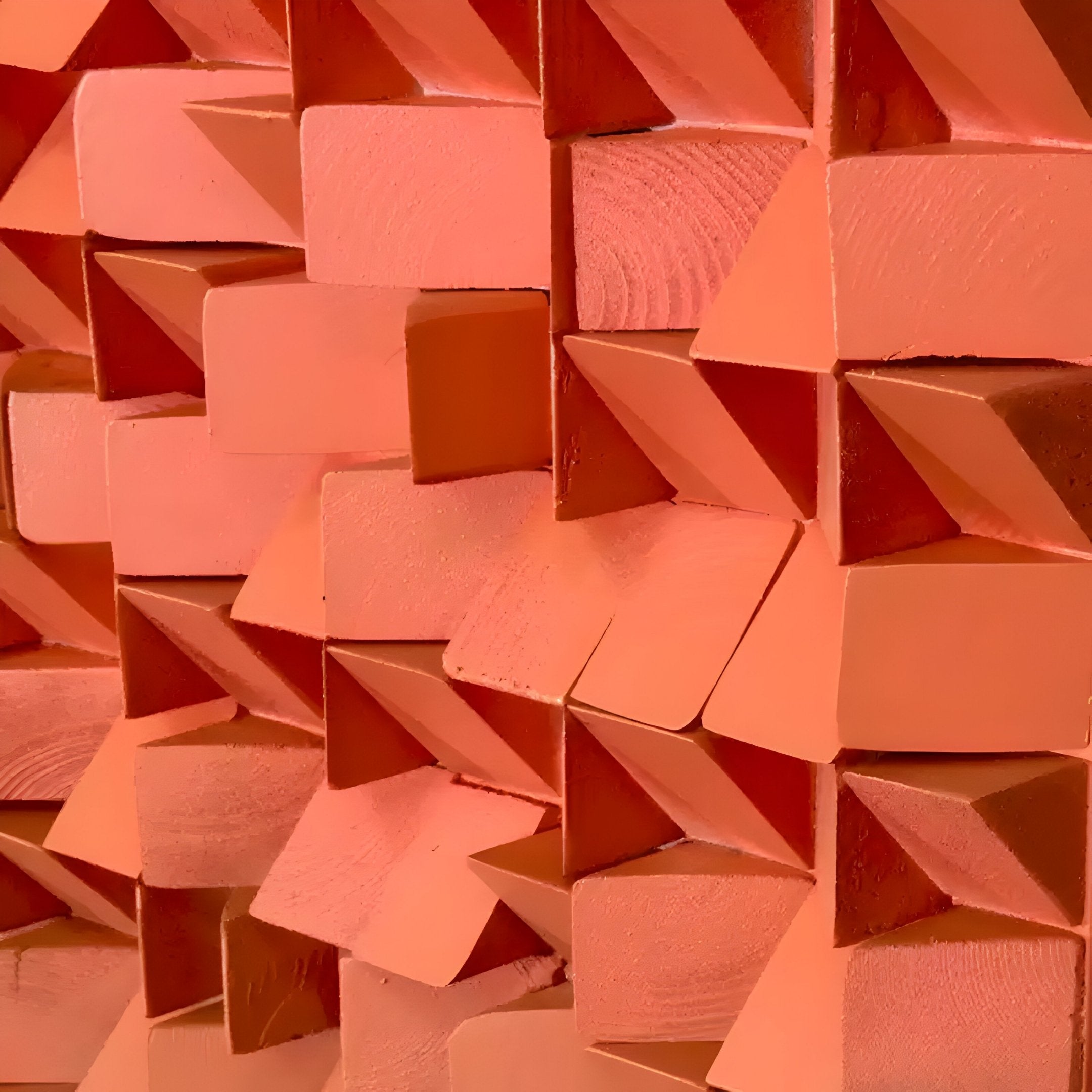 Close-up of the Stratiform Multitone Sunset Gradient Wood Mosaic 3D Wall Art by Giant Sculptures, showcasing geometric squares and triangles in orange hues for a textured and dynamic visual effect.