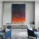 A modern lounge area boasts two blue chairs and a small table, set against Giant Sculptures Stratiform Twilight Hue Wood Mosaic 3D Wall Art. The vibrant backdrop, with its twilight gradient and textured design, is enhanced by soft lighting that casts gentle shadows across the space.