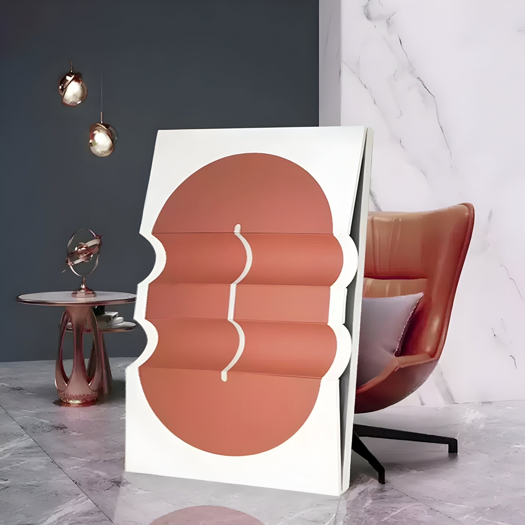 The modern interior features Giant Sculptures Ellipse Terracotta Oval Wood 3D Canvas Wall Art with overlapping white and terracotta shapes. Nearby, a sleek chair and small table with decor rest against a marble-mute wall, embodying warm minimalism.