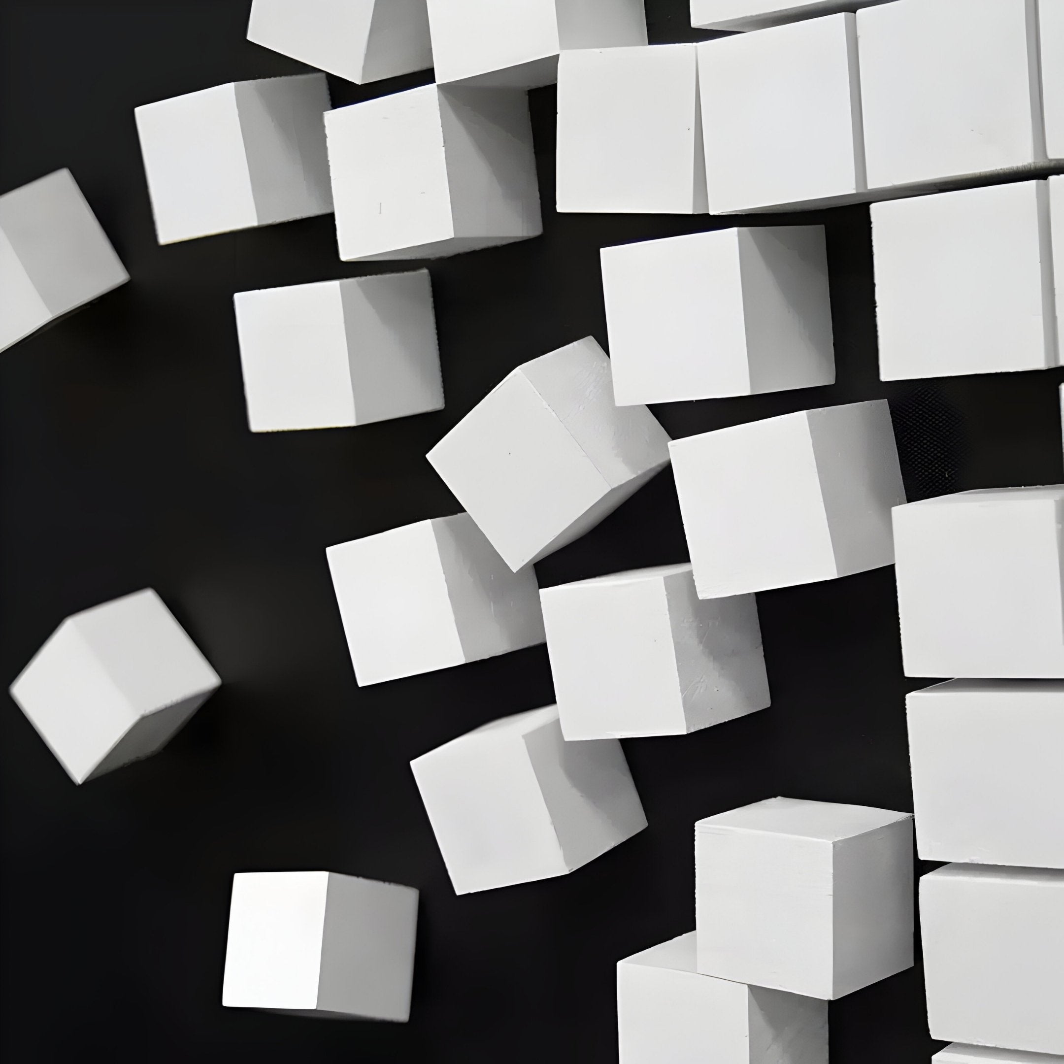 The Fragmenta White Wooden Cube Scatter On Black Canvas 3D Wall Art by Giant Sculptures offers a contemporary minimalist look with its floating cubes and striking contrast, adding depth and sophistication to modern spaces.