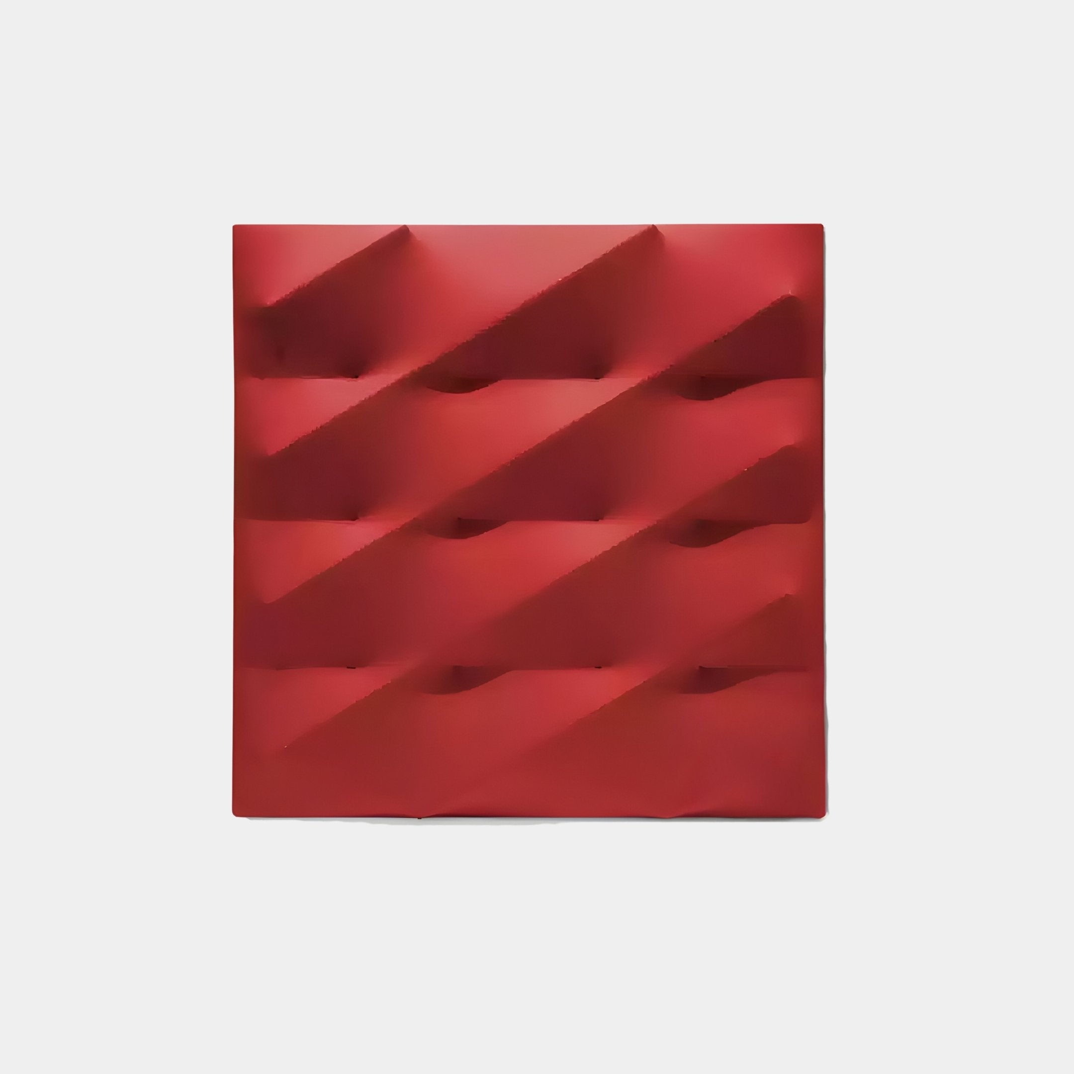 The Verto Bold Red Stretch Fabric Layered Wooden 3D Wall Art by Giant Sculptures features a square panel with a geometric, wave-like pattern of diagonal ridges. Its dynamic texture alternates between raised and recessed segments, set against a plain white background, perfect for modern interiors.