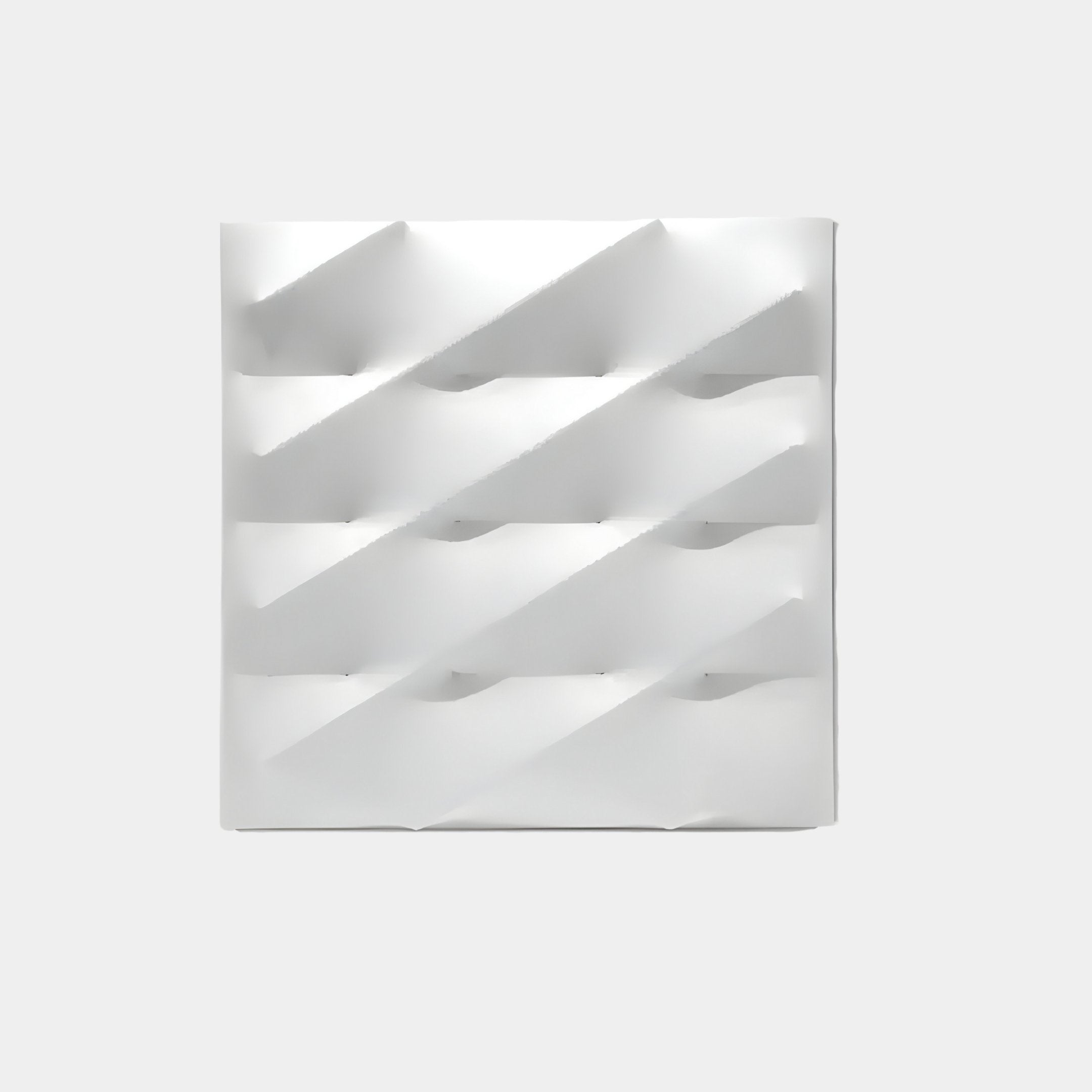 The Verto White Stretch Fabric Layered Wooden 3D Wall Art by Giant Sculptures exemplifies modern wall art with its minimalist geometric pattern, featuring diagonal ridges casting shadows in a symmetrical grid against a light gray background.