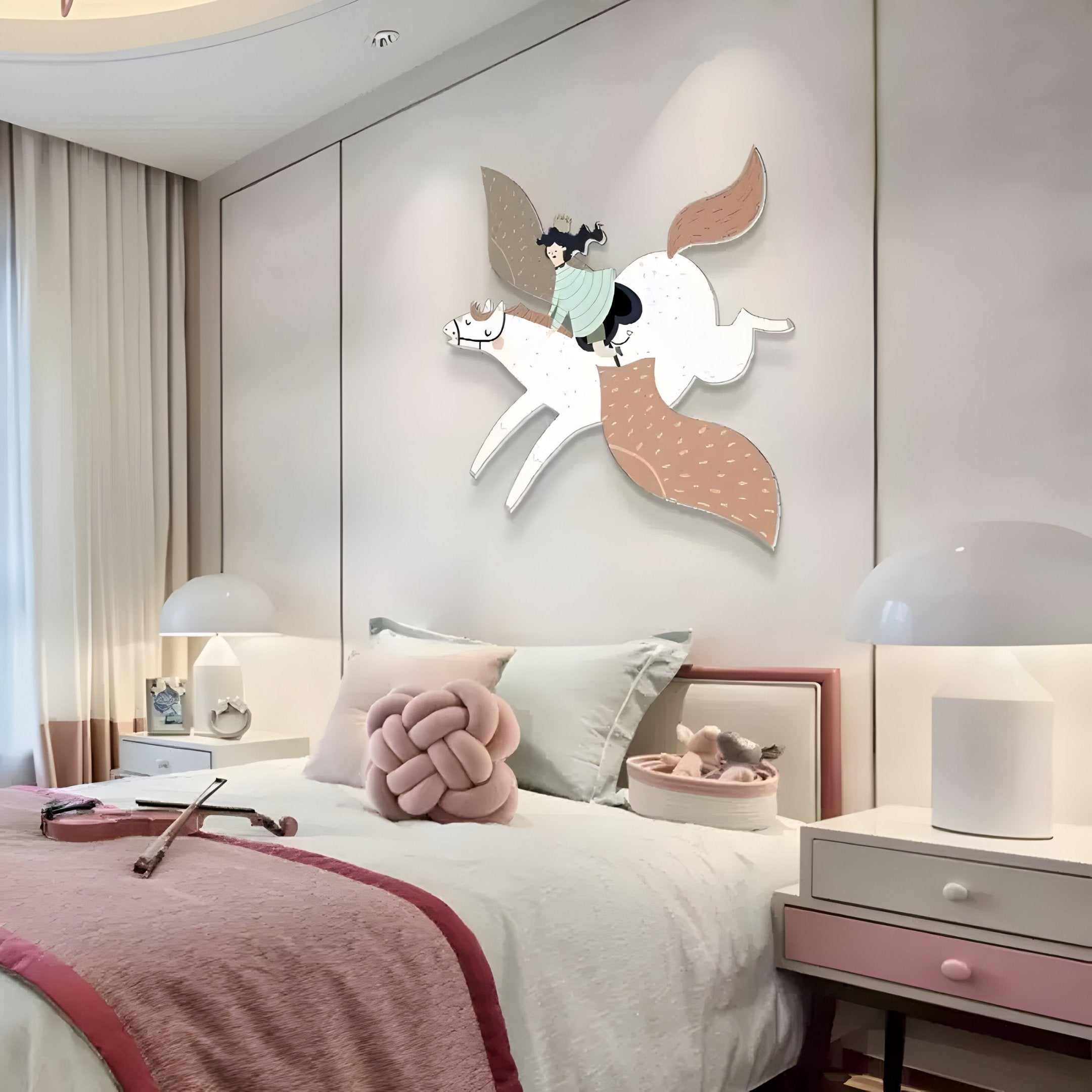 In a cozy bedroom, the Mythoria Journey Fairytale Horse Wooden LED Wall Art by Giant Sculptures adorns the wall, depicting a person on a winged horse. The bed sports a pink and white theme with a knot pillow and violin, while soft lighting and pastels enhance the serene childrens decor.