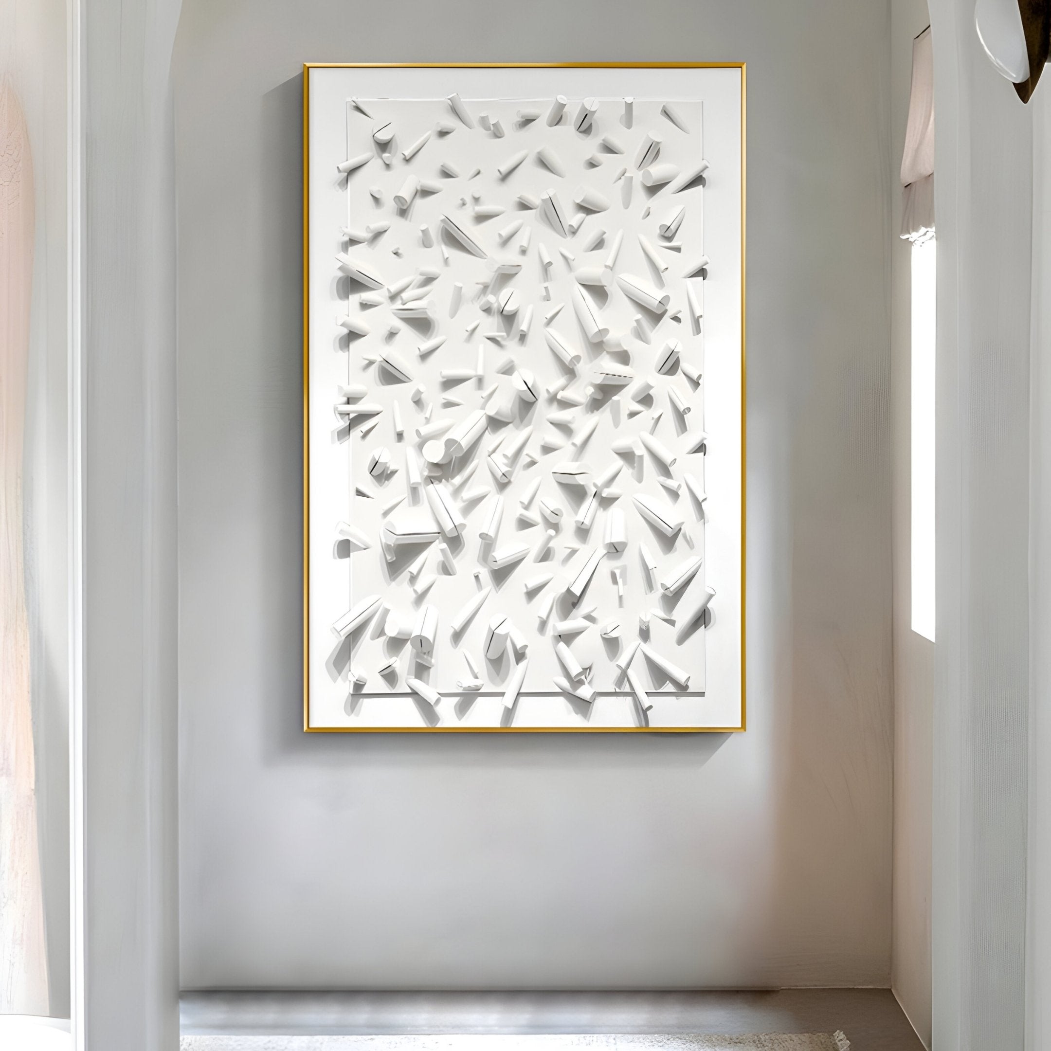 The Artiora White Abstract Wooden Shard 3D Wall Art by Giant Sculptures features large white geometric shapes in a minimalist room. This captivating centerpiece is enhanced by a simple frame and soft lighting, highlighting its textures and shadows.