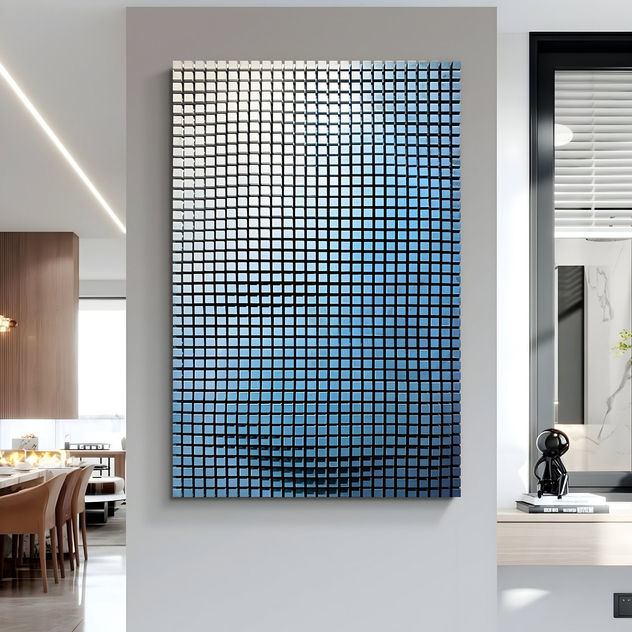 The Reflexion Blue Gradient Cube Mosaic 3D Wooden Wall Art by Giant Sculptures, featuring a grid of reflective blue and gray squares, is mounted in a contemporary dining room with a wooden table and elegant decor.