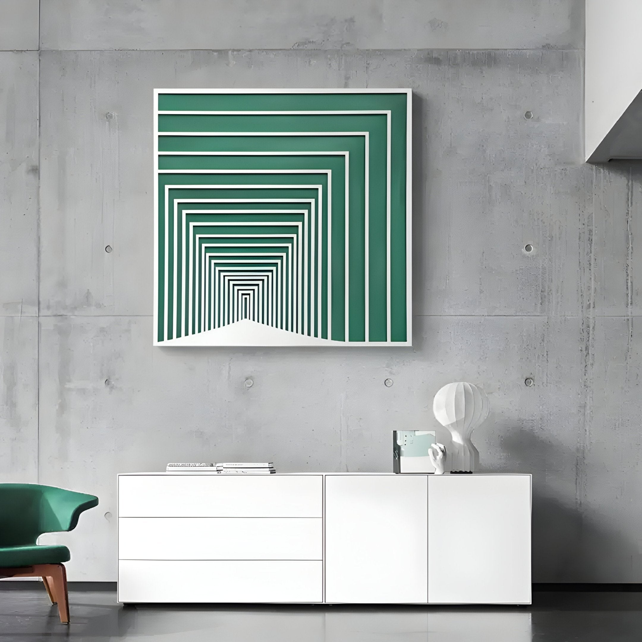 A modern living room showcases the Prismalux Green Wood Carving Hand-Painted 3D Wall Art by Giant Sculptures on a concrete wall. Below, a white console table hosts books, decor, and a lamp. A green chair to the left enhances the inviting ambiance.