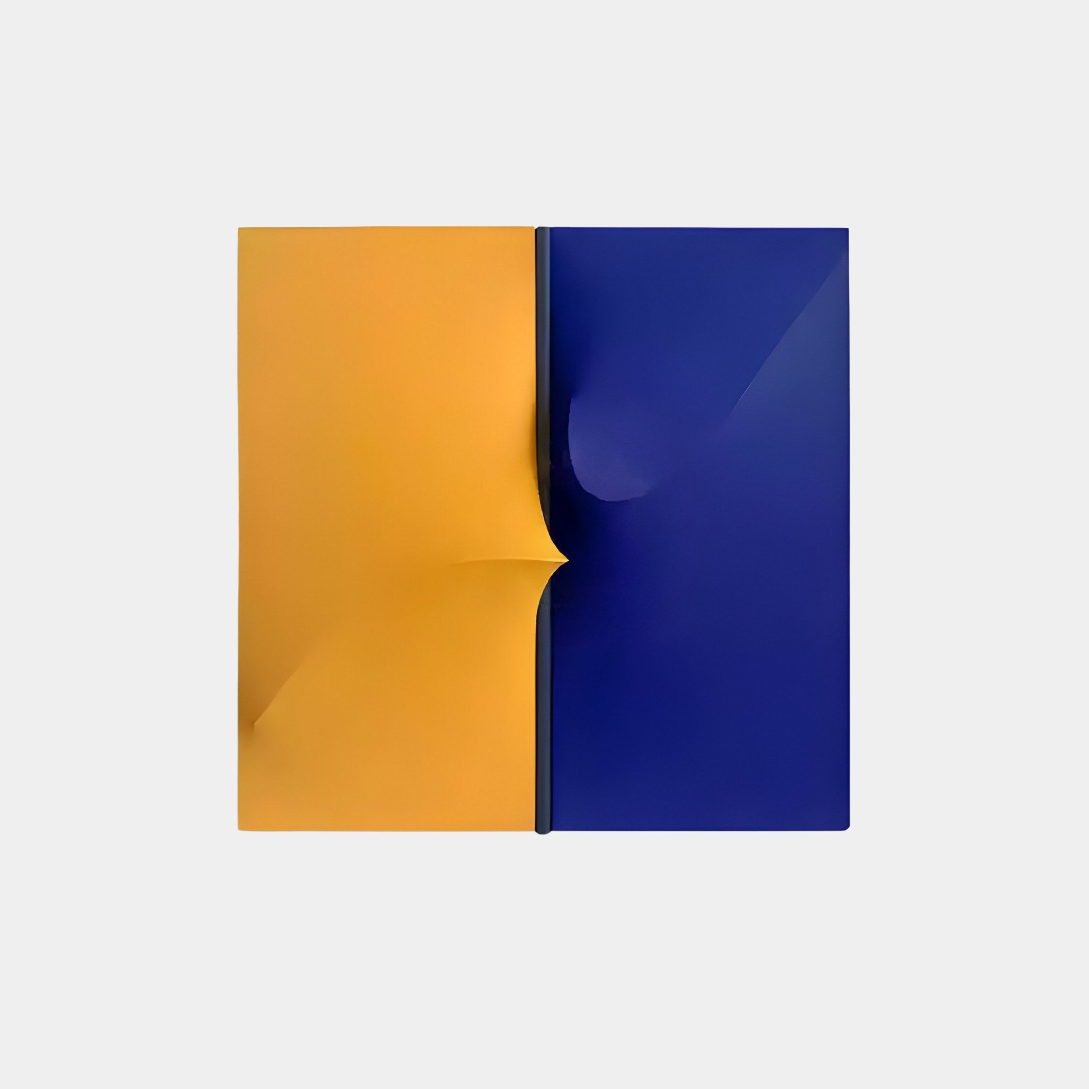 The Delinea Dual Contrast Yellow & Blue Fabric 3D Wood Relief Wall Art by Giant Sculptures features a vertically divided square with an orange side with a slight curl and a blue side, both against a plain white background.