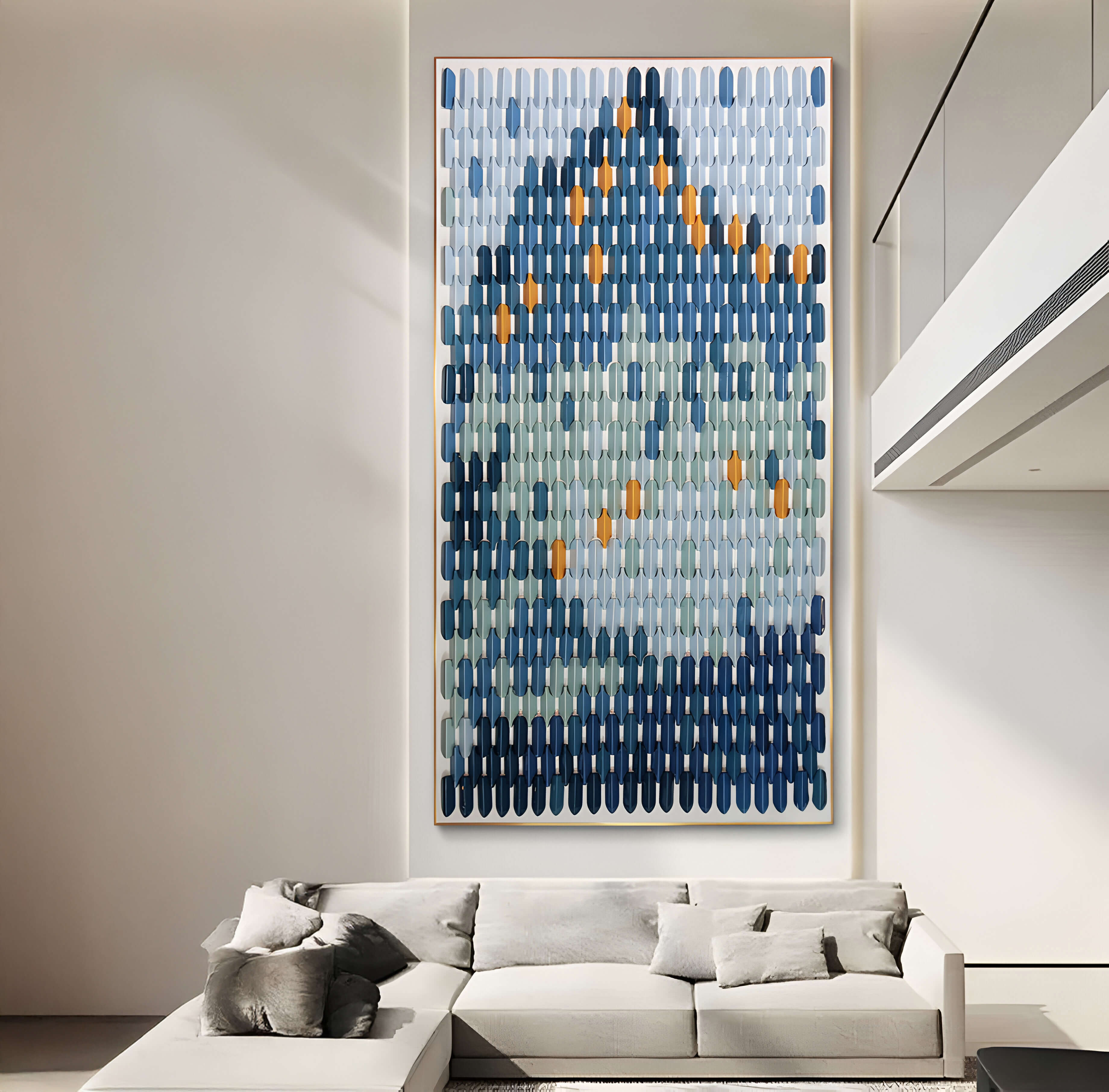 A modern living room features the Artevo 3D Ceramic Wall Art by Giant Sculptures, showcasing shades of blue, gray, and orange in an elongated pattern. A light-colored sectional sofa with cushions beneath the artwork exemplifies stylish interior design.